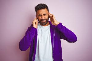 man-covers-ears