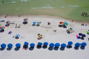 aerial-shot-of-florida-beach-with-umbrellas-and-people