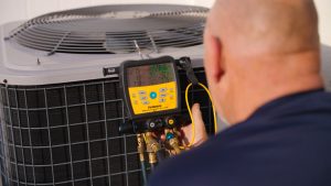 ac-tech-checking-condenser-outside