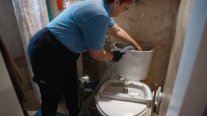 bayonet-female-plumber-fixing-toilet